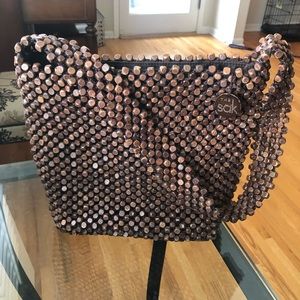 The Sak crochet wooden beaded bucket handbag